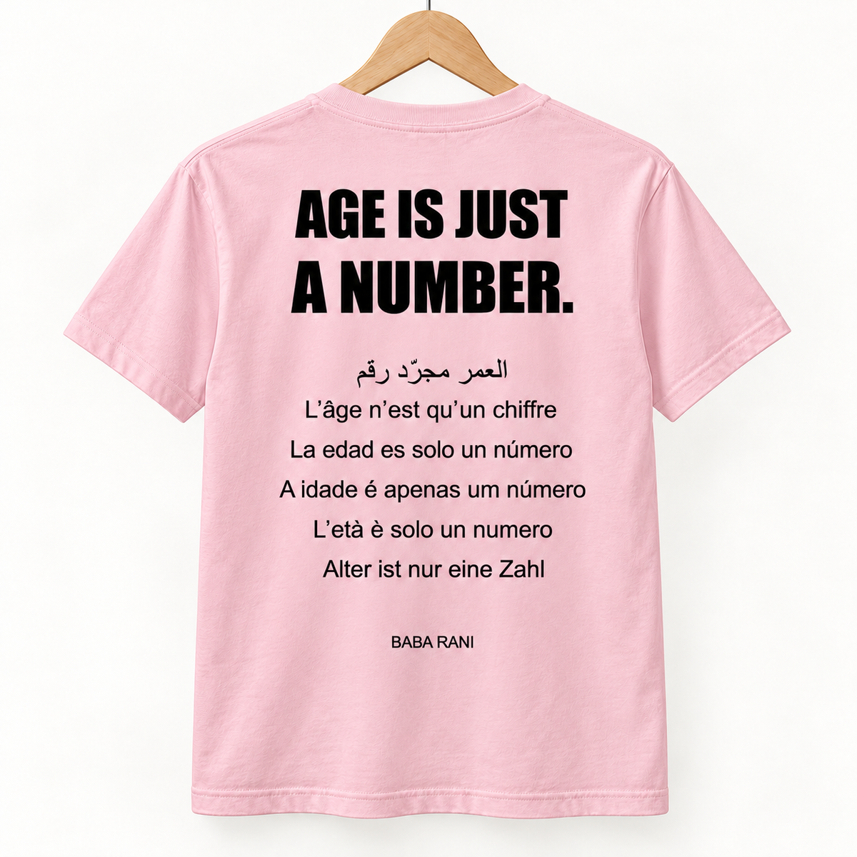 Age Is Just a Number Tee — Soft Pink — back on hanger, design visualization